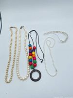 All five necklaces laid out