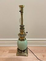 Full view of brass lamp showing green ceramic section and square base