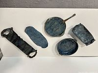 Overview of five of the six blue textured ceramic trays