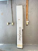 Sealed Preverco flooring box leaning against wall
