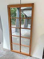 Front view showing wood frame and mirror panes