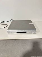 Front and top view of Sony 5-disc DVD/CD changer with power cord