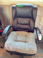 Full front view of chair showing overall design, upholstery, cushion and armrests