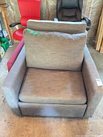 Front view of gray fabric armchair sleeper showing seat and back cushions