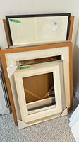 Stack of eight frames showing variety of finishes and sizes