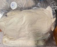 Vacuum-sealed bag containing cream blankets