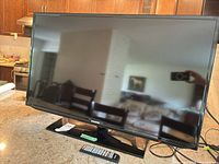 Front view of Samsung TV on countertop with screen off