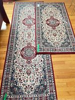 Both runner rugs laid out showing full patterns and relative sizes