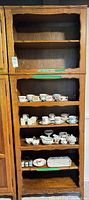 Full frontal view showing bookcase with five shelves