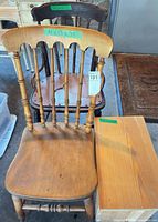 Front view of both Windsor chairs and wooden box/bench