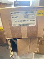 Box label showing Certolux branding, model number 50065 / CRV48-LED835K050LUNV-P69, voltage 120-277 V, NEMA 4X