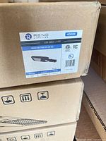 Label on box showing model, wattage, colour temperature and certifications