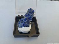 Lapis specimen mounted in box, frontal view