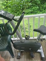 Full left side view of LifeGear upright exercise bike on porch