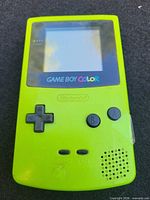 Front view of lime green Game Boy Color showing buttons, screen, speaker