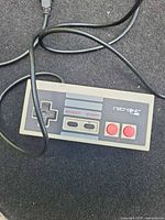 Top view of Retrolink NES-style controller showing buttons and logo