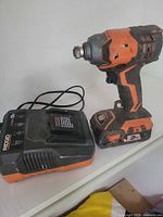 Impact driver with battery and charger overview