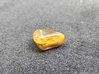 Front view of polished tiger's eye stone