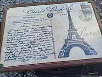 Top of trunk showing Carte Postale script and Eiffel Tower graphic