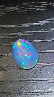 Front view of oval Ethiopian opal showing play-of-color