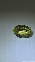 Oval lemon citrine gemstone front view on neutral background