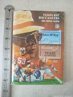Front cover showing title, John McKay feature, ruler for scale