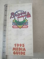Front cover showing title and team logo with ruler for scale