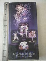 Front cover of 1997 Colorado Rockies Media Guide with ruler for scale