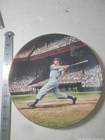 Front view showing Joe DiMaggio artwork and gold rim with ruler for scale