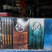 Front of shrink-wrapped group showing several season cases and 24 logo