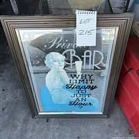 Full view of framed mirror showing graphic and text