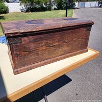 Closed chest showing front panel and metal corner brackets