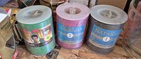 Front view of three spools showing labels and colors