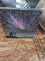Front view of acrylic painting showing night sky scene and figure with telescope