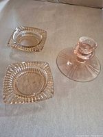 overview of candle holder and two square ashtrays