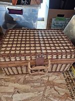 Closed wicker picnic basket front view