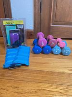 Grouped view of all dumbbells, ankle weights and packaged gloves