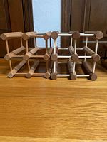 Front view of all three modular wood wine racks side-by-side