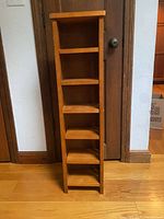 front view of tall slim six-shelf storage tower