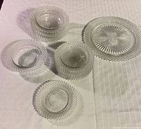 Group view of five bowls and one large plate showing pattern and transparency