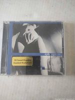 Front view of Cyborgasm CD in jewel case showing cover art and 3D sound sticker