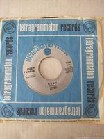 Front of record in company sleeve showing Hush label
