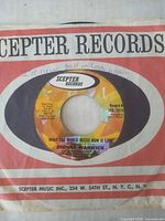 Front of sleeve and record showing label and handwritten note