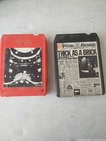 Front view of both 8-track tapes showing album artwork