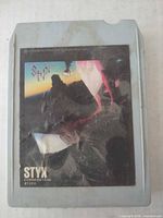 Front view showing album art and cartridge color