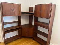 Full view of three-section teak veneer wall unit assembled