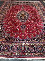 Full view of the rug showing pattern, borders and fringe