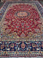 Full view showing entire red field, navy border and fringe