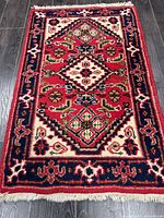 Full rug showing pattern, colours and fringe
