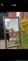 Front view of one brown vinyl double-hung window